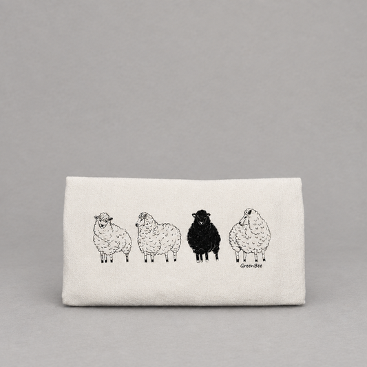Black Sheep Dish Tea Towel on a light grey background