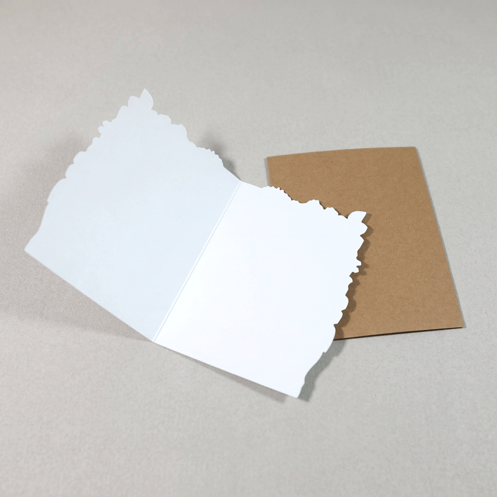 Blank card interior and envelope on muted light-grey background