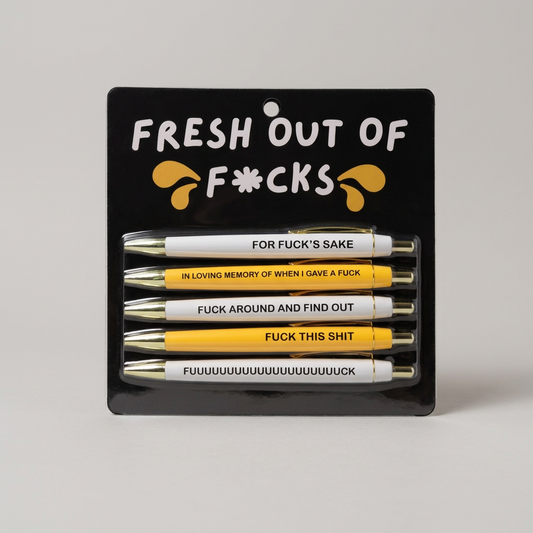 Alternate front view of Fresh Out of Fucks pen set on muted light grey background