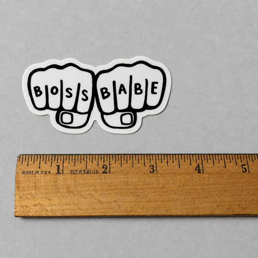 Impish Greetings Boss Babe sticker featuring two fists bumping with black lettering on thick glossy white vinyl