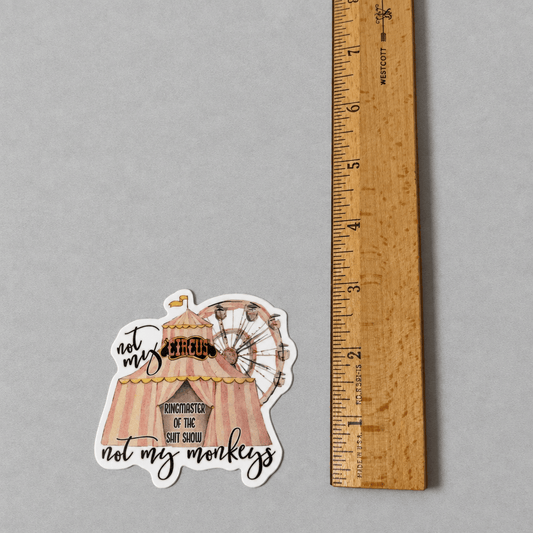 Impish Greetings Not My Circus Not My Monkeys vinyl sticker with a circus tent design and matte finish next to a ruler