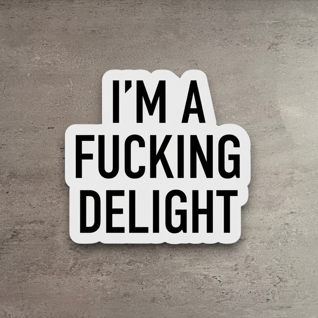 Impish Greetings vinyl sticker featuring the bold black text I'm a Fucking Delight on a white matte background.