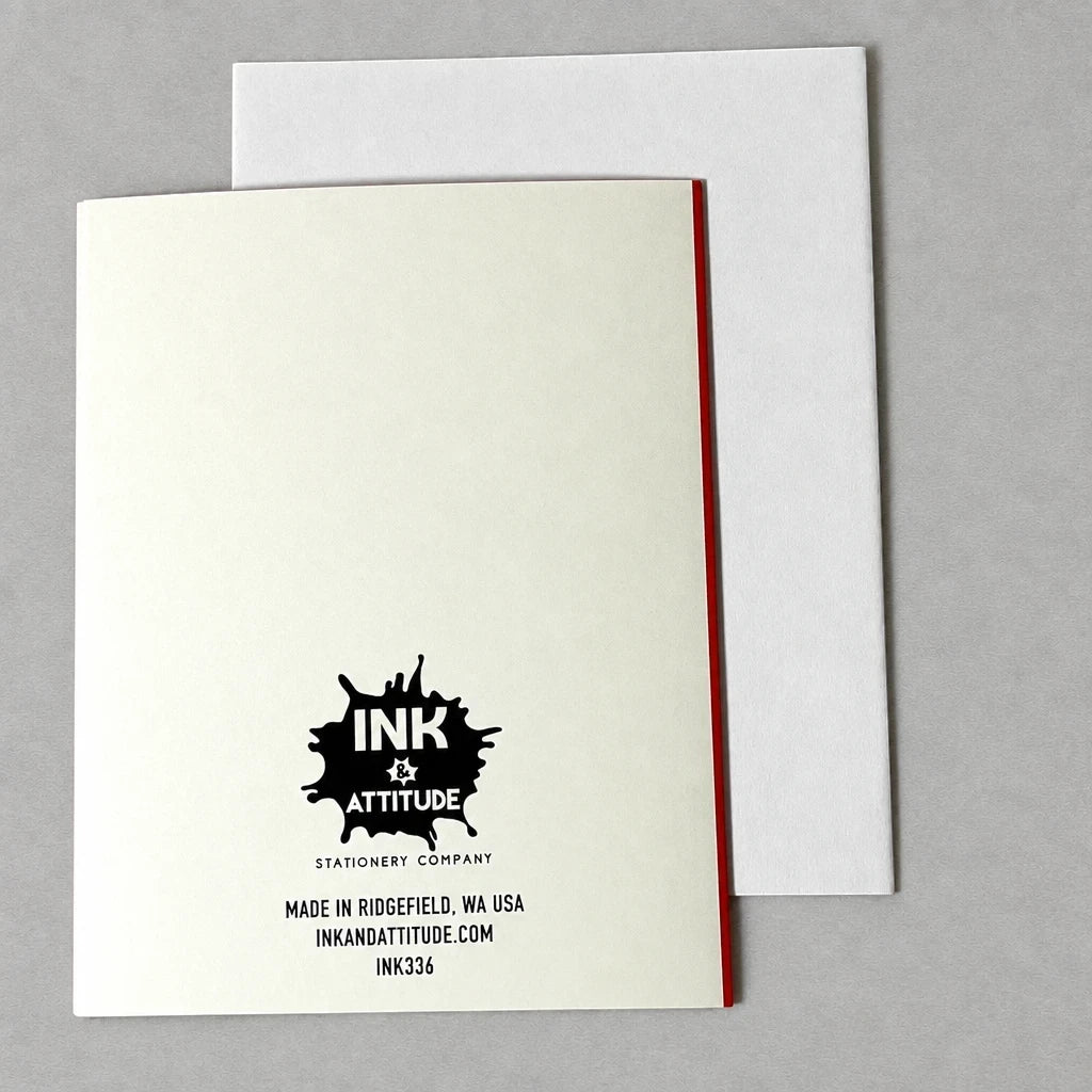 Back of Impish Greetings A2 greeting card featuring the Ink & Attitude logo and a white envelope on a grey background