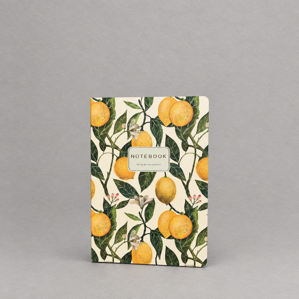 Impish Greetings A5 notebook featuring a cheerful yellow lemon and green leaf print on a softcover.