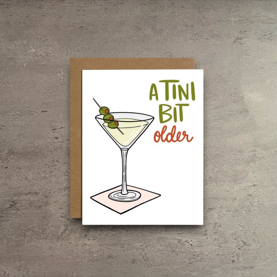 Impish Greetings A Tini Bit Older birthday card featuring a martini illustration with olives on a kraft envelope.