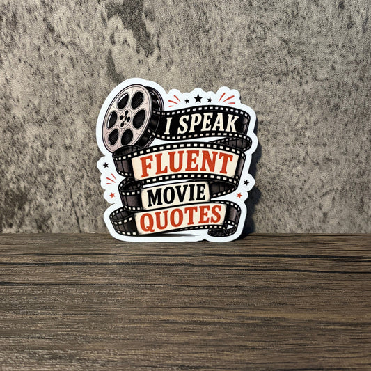 Impish Greetings I Speak Fluent Movie Quotes sticker with film reel design, red and black text on a glossy finish.