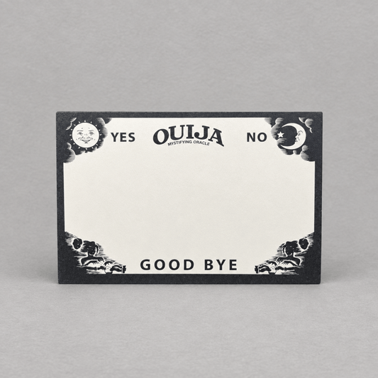 Impish Greetings Ouija board notepad with black and white mystical sun and moon illustrations on recycled paper