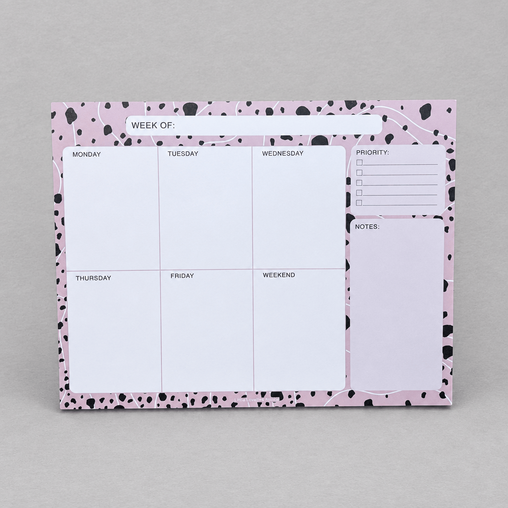 Impish Greetings Week Of Productivity Notepad with pink and black dalmatian print border and daily planning sections.