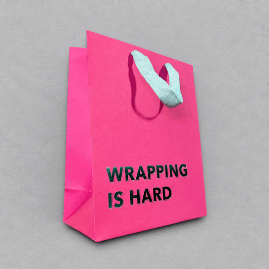 Wrapping is Hard Gift Bag Magenta photo 2 on the lighter grey backdrop