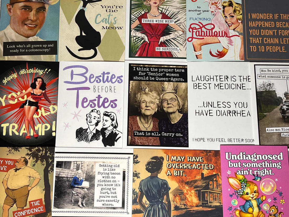 Flat-lay assortment of vintage-inspired funny greeting cards from Impish Greetings