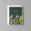 Card front on a muted light-grey background
