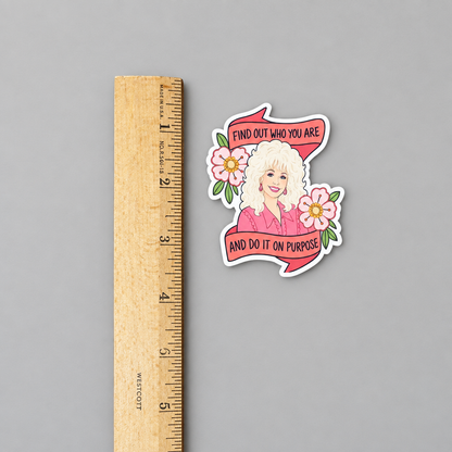 Dolly quote sticker against a light grey background with a ruler to show dimensions
