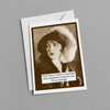 Vintage-style card with a black and white photo of a woman and humorous text on a textured surface.