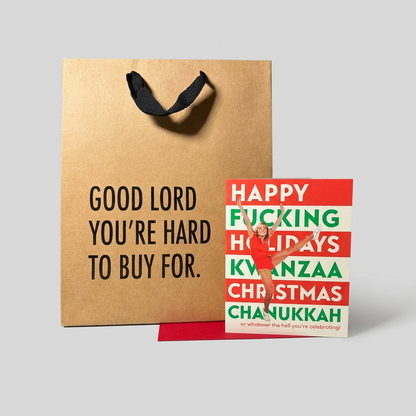 Alternate view of holiday card and kraft gift bag on muted light grey background