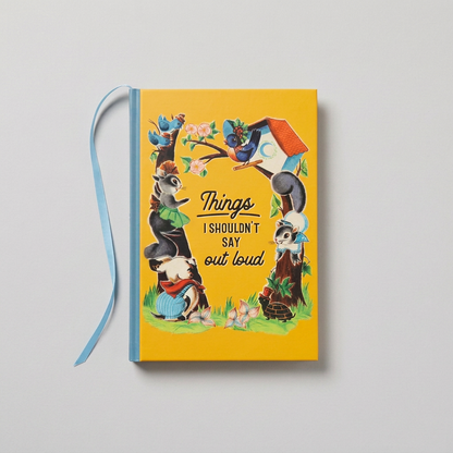 Things I Shouldn't Say Out Loud notebook with blue ribbon on muted light grey background