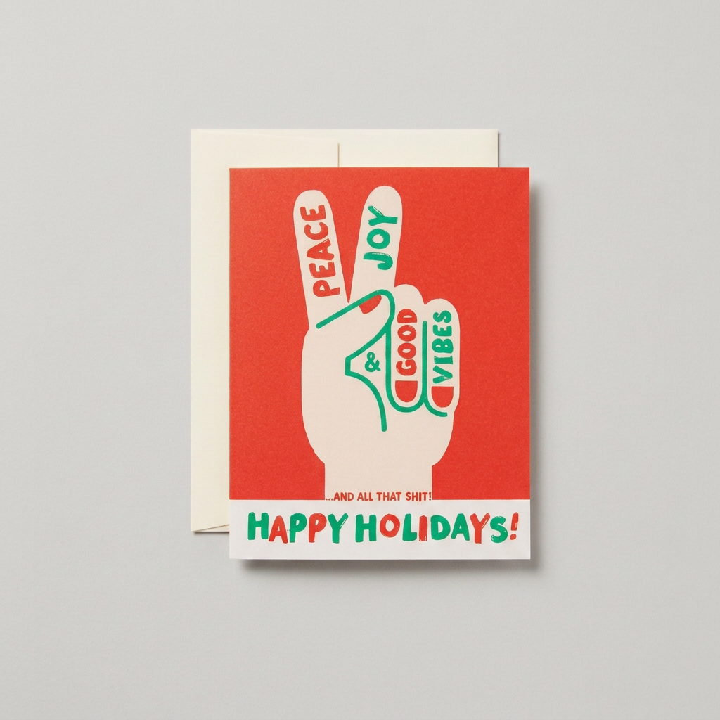 Good Vibes peace-sign holiday card and cream envelope on a muted light grey background