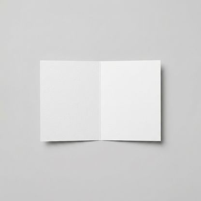 Blank white greeting card interior on a muted light grey background