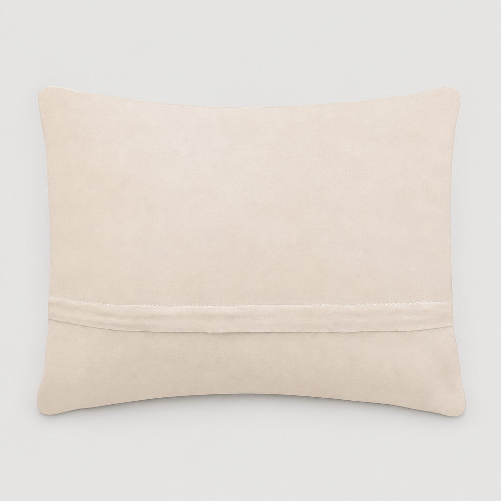 Cream velvet backing and zipper of Mama Tried pillow on light grey