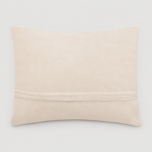 Cream velvet backing and zipper of Mama Tried pillow on light grey