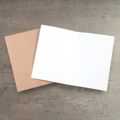 Impish Greetings funny anniversary card with a kraft envelope on a grey textured background