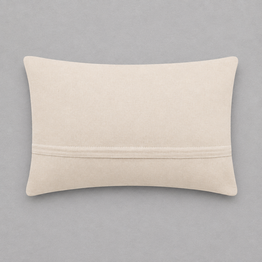 Impish Greetings Dog Person hook pillow showing the plain beige velvet back with a hidden zipper closure