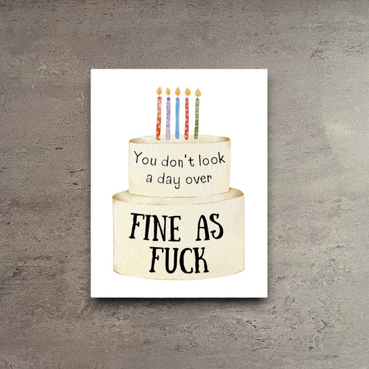 Birthday card with a two-tier cake illustration and the text You don't look a day over FINE AS FUCK