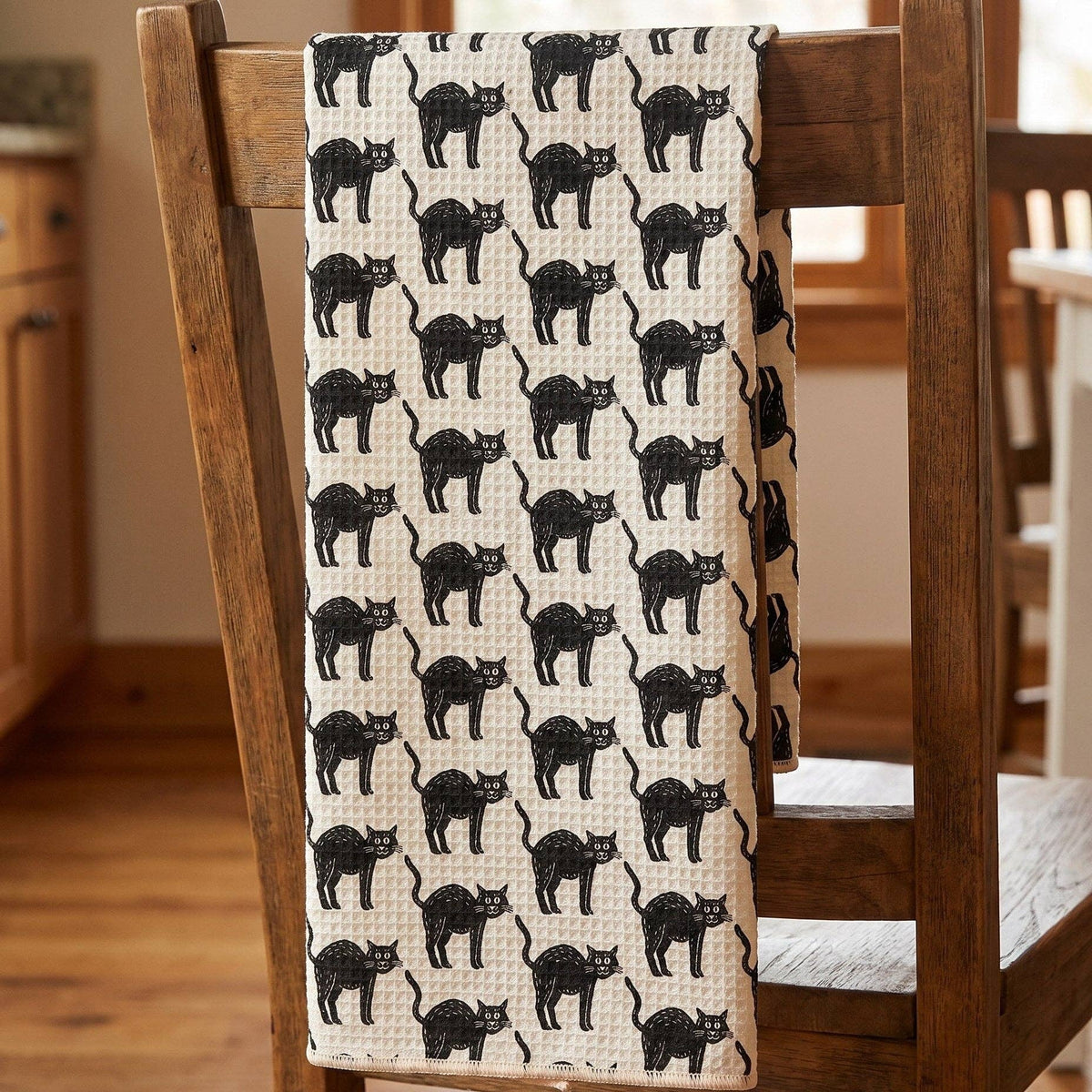 Impish Greetings black cat Halloween tea towel with hand-drawn feline pattern on absorbent Grip-Tex fabric