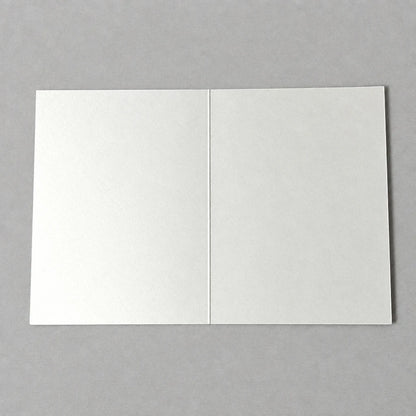 Impish Greetings blank A2 greeting card on thick white cardstock, shown open on a neutral grey background.