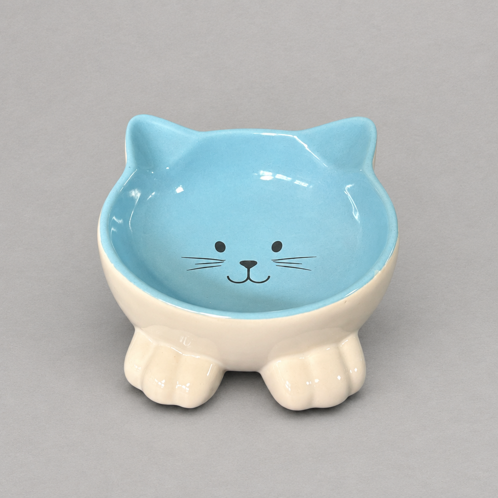 Impish Greetings blue ceramic cat-shaped bowl with a tilted design to support feline posture and neck health.