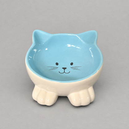 Impish Greetings blue ceramic cat-shaped bowl with a tilted design to support feline posture and neck health.