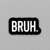 Impish Greetings Bruh vinyl sticker with white bold text on a black matte background