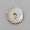 Impish Greetings handcrafted ceramic mini plate with a speckled glaze and a black Buddha face illustration