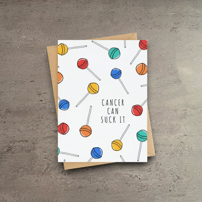 Impish Greetings Cancer Can Suck It get well card with colorful lollipop pattern on white cardstock and kraft envelope