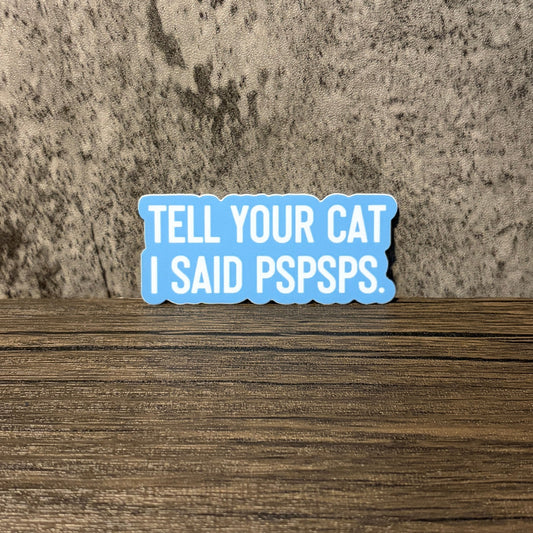 Impish Greetings Tell Your Cat I Said Pspsps vinyl sticker with white text on a light blue background