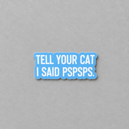 Impish Greetings vinyl sticker with white text reading Tell Your Cat I Said Pspsps on a blue background.