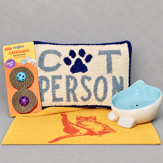 Impish Greetings Fe-line Groovy Bundle featuring a Cat Person hook pillow, cat face bowl, toy, and cat print tote.