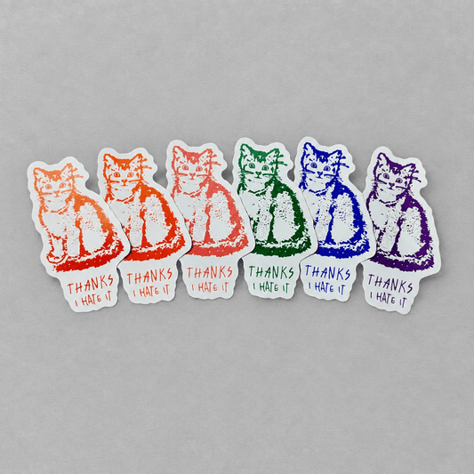 Impish Greetings Thanks, I Hate It vinyl stickers featuring a cat illustration in various vibrant colors.