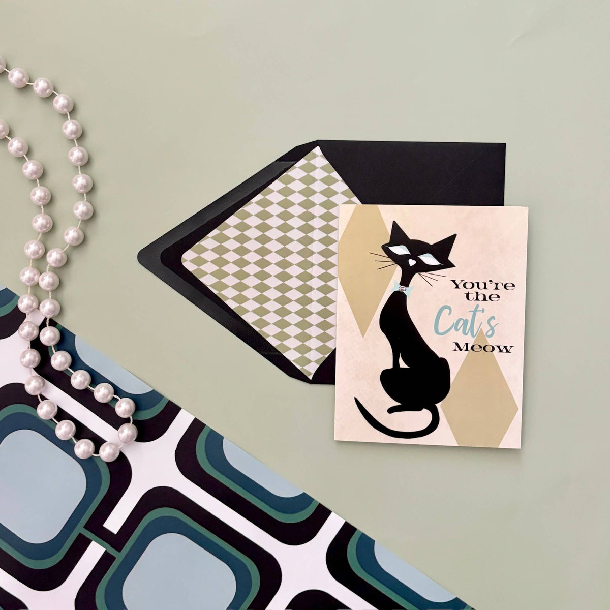 Impish Greetings Cat's Meow greeting card with mid-century modern cat illustration and checkered envelope