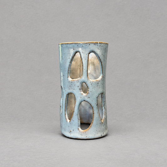 Impish Greetings handcrafted ceramic ghost luminary with a speckled blue glaze and cutout face for tea light candles