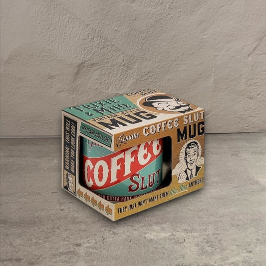 Impish Greetings 12 oz porcelain Coffee Slut mug in vintage-style packaging with retro typography and illustrations.