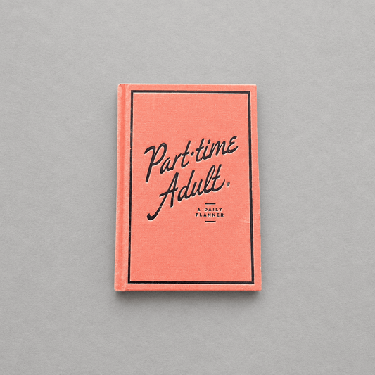 Impish Greetings Part-Time Adult undated planner with a coral cloth-bound cover and black embossed foil lettering.