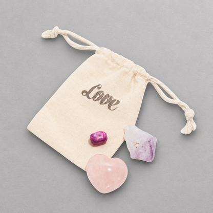 Impish Greetings LOVE + HAPPINESS crystal gift set with rose quartz heart, amethyst point, and agate in a pouch.