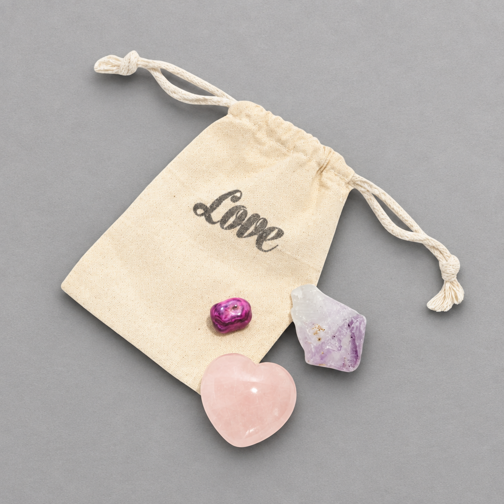 Impish Greetings LOVE + HAPPINESS crystal set featuring rose quartz heart, amethyst point, and agate in a pouch.