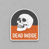 Impish Greetings Dead Inside sticker featuring a white skull on a black and orange background with glossy finish.