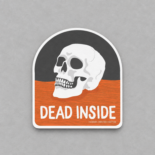 Impish Greetings Dead Inside sticker featuring a white skull on a black and orange background with glossy finish.