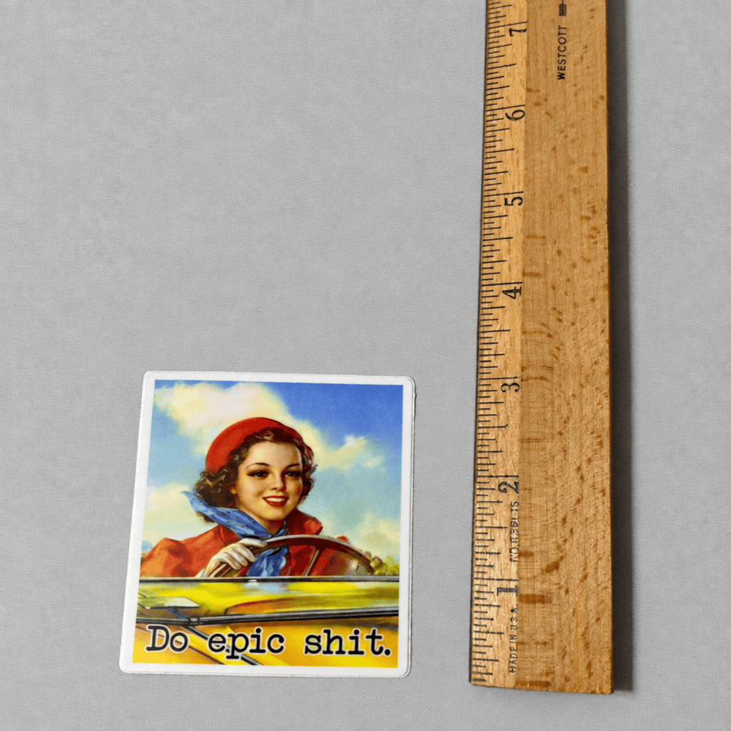 Impish Greetings Do Epic Shit vinyl sticker featuring a vintage-style woman driving a car with a matte finish.