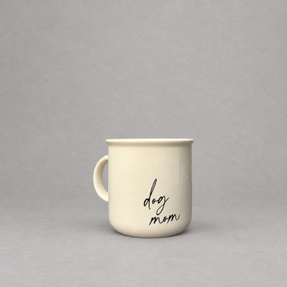 Impish Greetings 11 oz cream ceramic campfire-style coffee mug with black script text reading dog mom