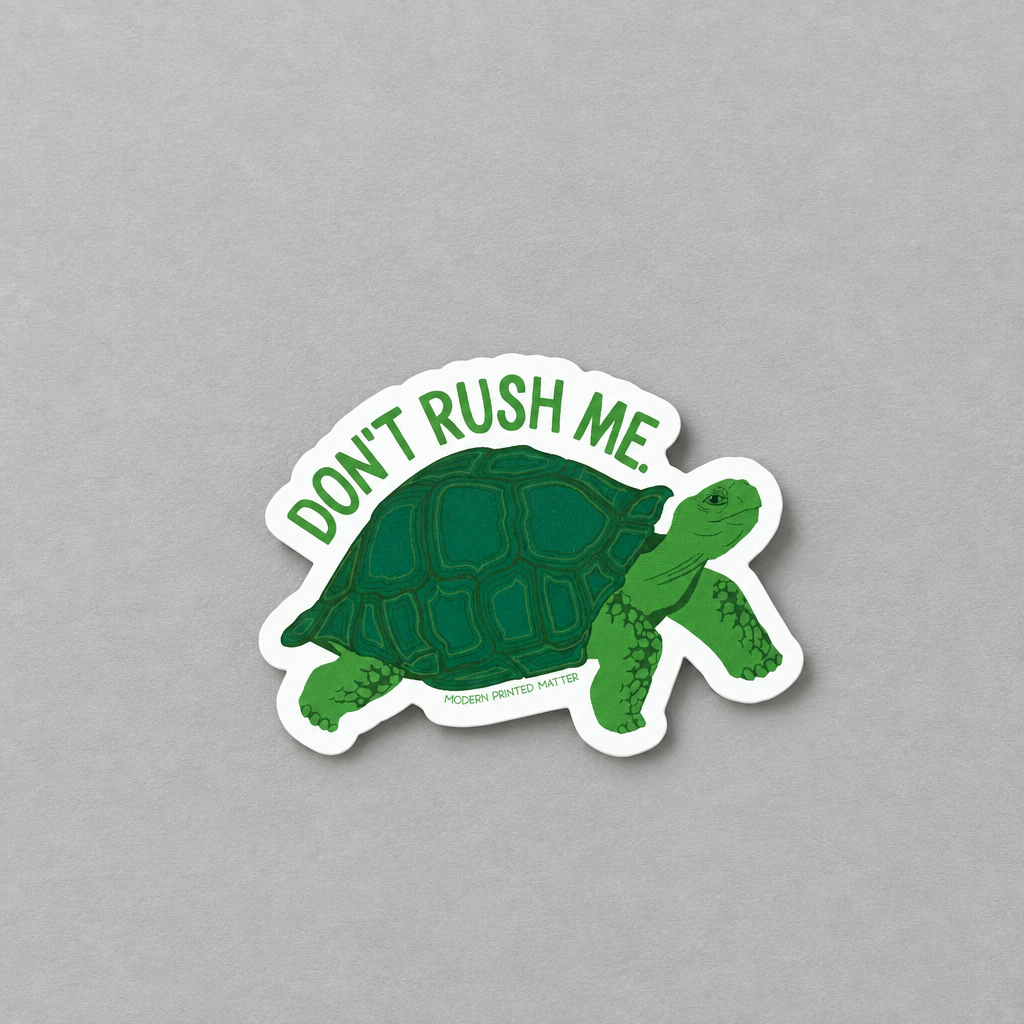 Impish Greetings Don't Rush Me sticker featuring a green turtle illustration with text on a grey background.