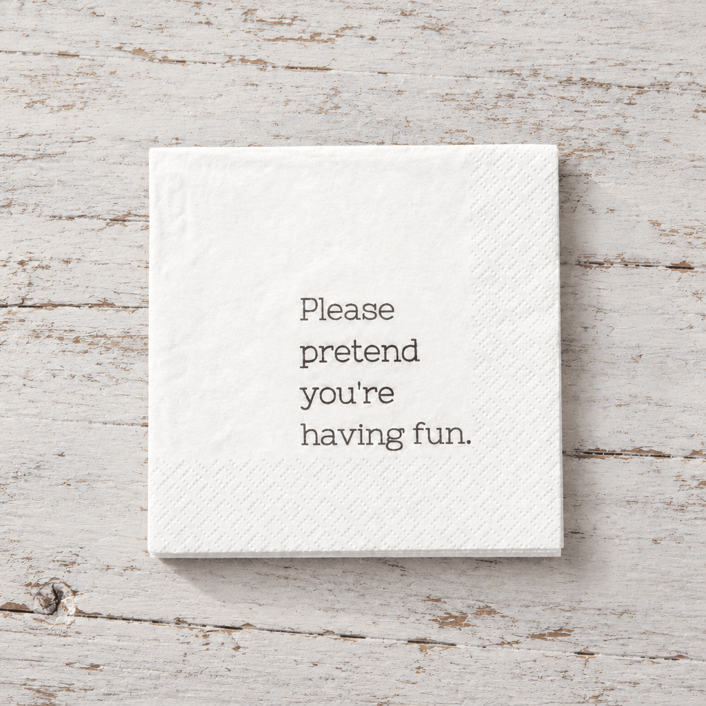 Impish Greetings white 3-ply cocktail napkin with the text Please pretend you're having fun printed in black