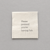 Impish Greetings cocktail napkin in cream 3-ply paper with the text Please pretend you're having fun printed in black